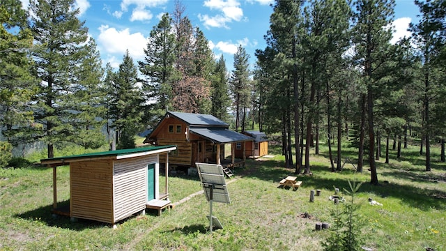 3408 Whiskey Jack Ln, Hamilton, MT 59840 - view of grassy yard featuring an outbuilding