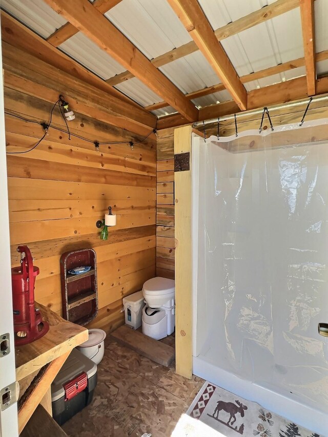 3408 Whiskey Jack Ln, Hamilton, MT 59840 - bathroom with curtained shower and wooden walls
