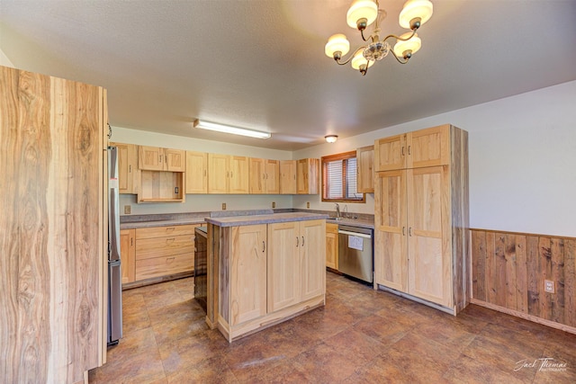 854 State Highway 282, Clancy, MT 59634 - kitchen with light brown cabinetry, stainless steel appliances, a chandelier, wooden walls, and a kitchen island
