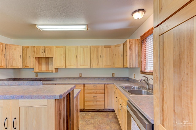 854 State Highway 282, Clancy, MT 59634 - kitchen with light brown cabinetry and stainless steel dishwasher