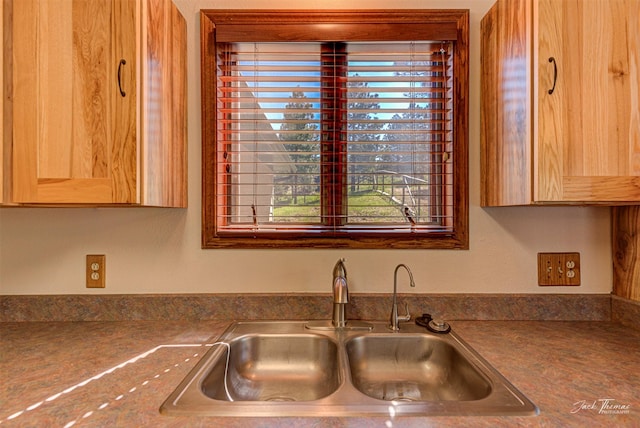 854 State Highway 282, Clancy, MT 59634 - kitchen with healthy amount of natural light, dark countertops, and light brown cabinets