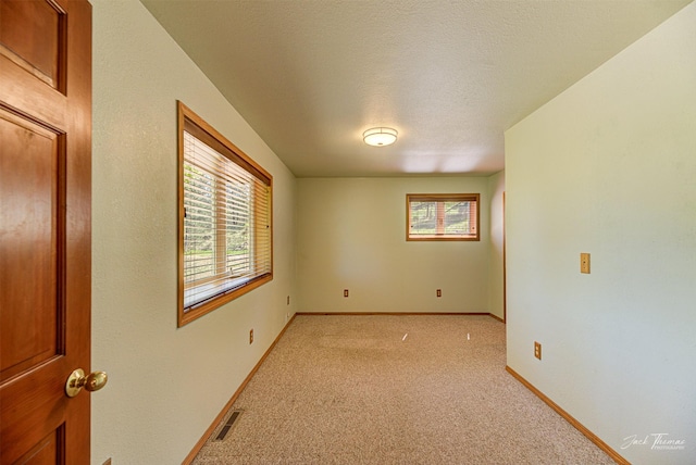 854 State Highway 282, Clancy, MT 59634 - spare room featuring light colored carpet and baseboards