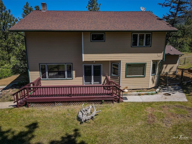 854 State Highway 282, Clancy, MT 59634 - back of property featuring a yard, a chimney, a wooden deck, and a shingled roof