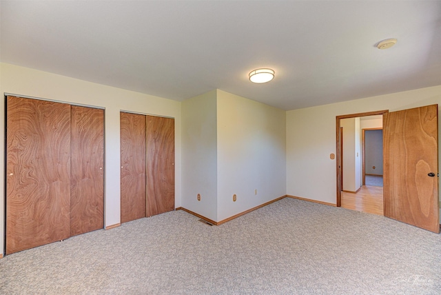 854 State Highway 282, Clancy, MT 59634 - unfurnished bedroom featuring carpet floors and two closets