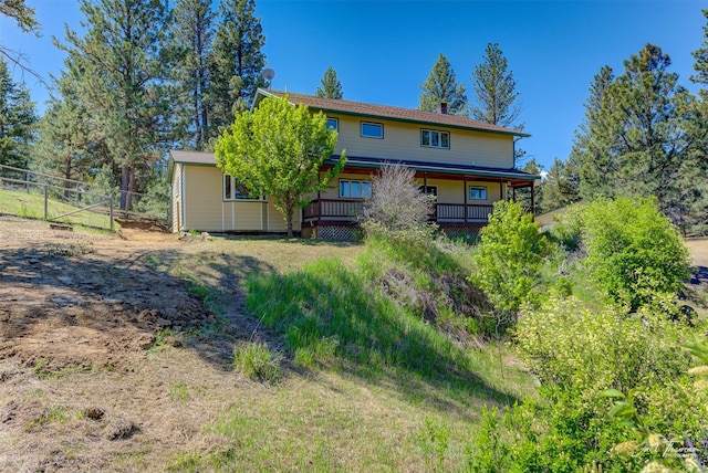 854 State Highway 282, Clancy, MT 59634 - rear view of property featuring a porch and a chimney