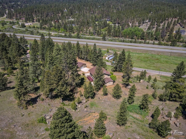 854 State Highway 282, Clancy, MT 59634 - aerial view of property and surrounding area featuring a heavily wooded area