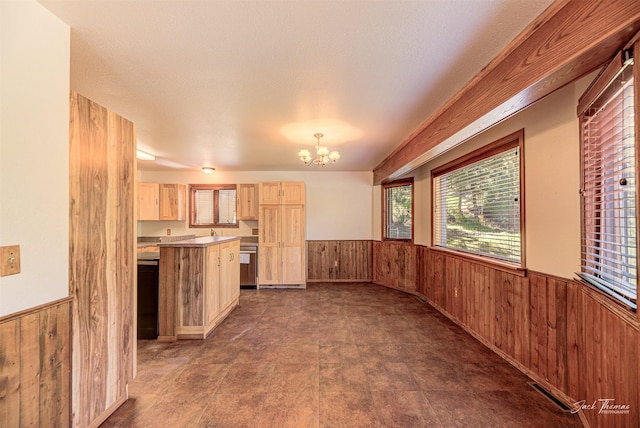 854 State Highway 282, Clancy, MT 59634 - kitchen featuring wooden walls, light brown cabinets, wainscoting, a chandelier, and dishwasher