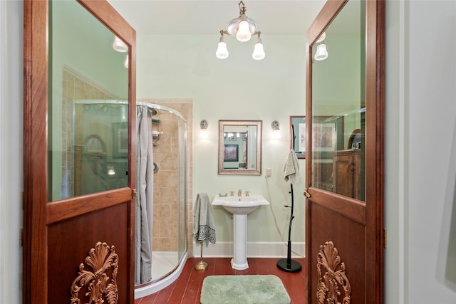 1003 N Burnt Fork Rd, Stevensville, MT 59870 - full bathroom featuring a stall shower and wood finished floors
