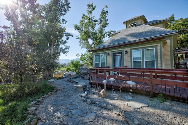 1003 N Burnt Fork Rd, Stevensville, MT 59870 - view of front facade with a wooden deck and roof with shingles