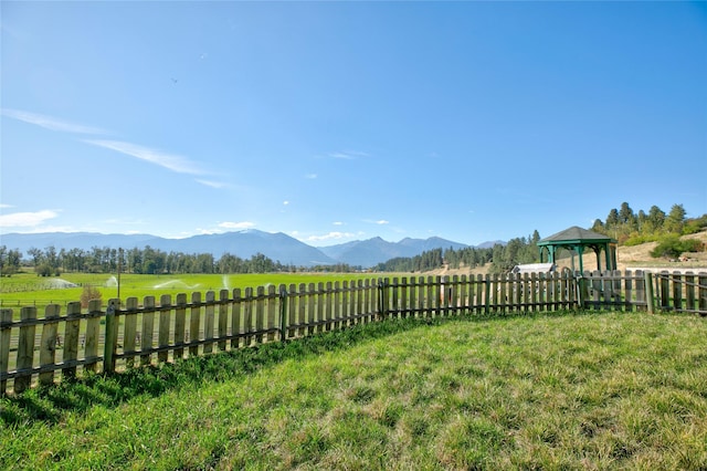 1003 N Burnt Fork Rd, Stevensville, MT 59870 - fenced backyard featuring a mountain view, a gazebo, and a rural view