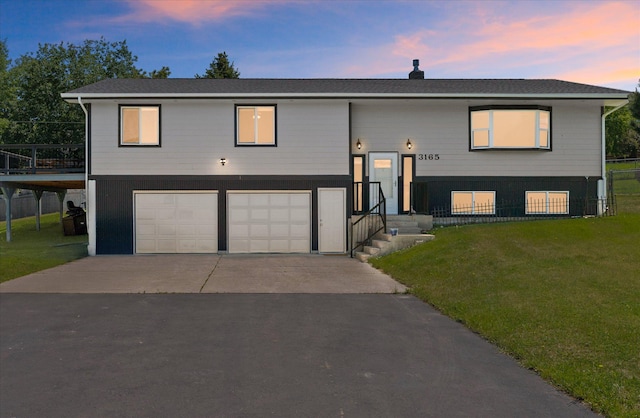 3165 Lamoreux Ln, Missoula, MT 59803 - raised ranch with a garage, a yard, and driveway