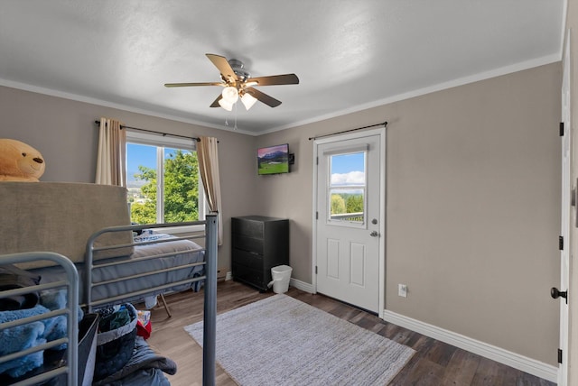 3165 Lamoreux Ln, Missoula, MT 59803 - bedroom featuring baseboards, wood finished floors, crown molding, and ceiling fan