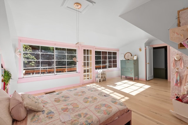24194 Mt Highway 35, Bigfork, MT 59911 - bedroom with lofted ceiling and wood finished floors
