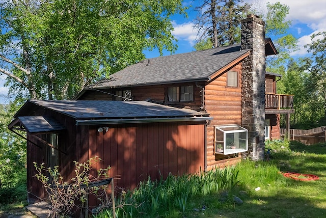 24194 Mt Highway 35, Bigfork, MT 59911 - rear view of property with a chimney and roof with shingles