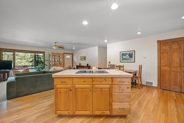 176 Blaine Ridge Rd, Kalispell, MT 59901 - kitchen featuring black electric stovetop, recessed lighting, light wood finished floors, ceiling fan, and open floor plan