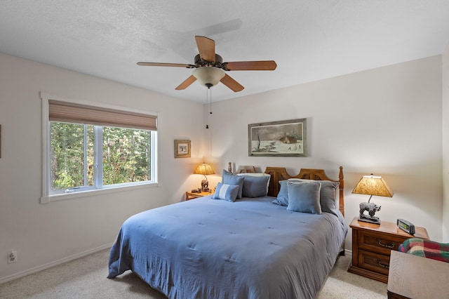 176 Blaine Ridge Rd, Kalispell, MT 59901 - bedroom with light colored carpet and a ceiling fan