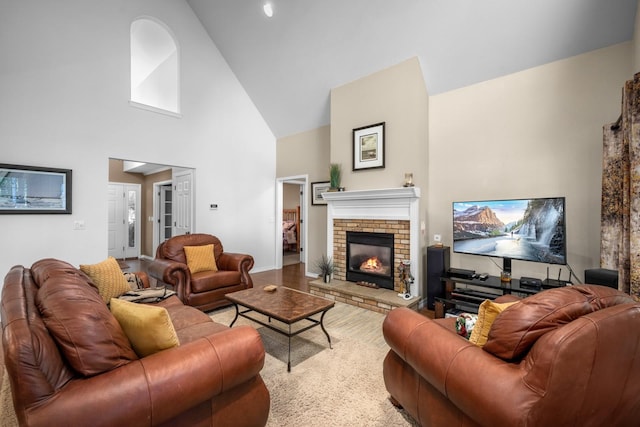 3 Bearberry Ln, Whitefish, MT 59937 - living room with high vaulted ceiling, a fireplace, and wood finished floors