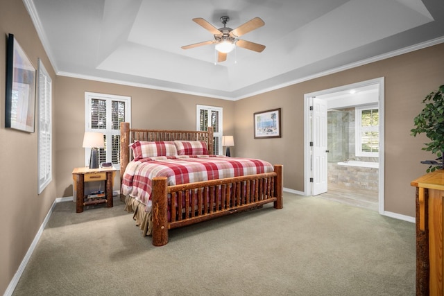 3 Bearberry Ln, Whitefish, MT 59937 - bedroom with a tray ceiling, carpet flooring, connected bathroom, crown molding, and a ceiling fan