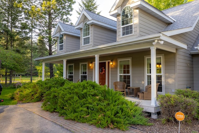 3 Bearberry Ln, Whitefish, MT 59937 - view of front of house featuring a porch and a shingled roof