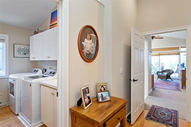 267 Eagle Bend Dr, Bigfork, MT 59911 - laundry room with cabinet space, independent washer and dryer, ceiling fan, and light wood finished floors