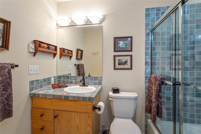267 Eagle Bend Dr, Bigfork, MT 59911 - full bathroom with vanity, toilet, and enclosed tub / shower combo