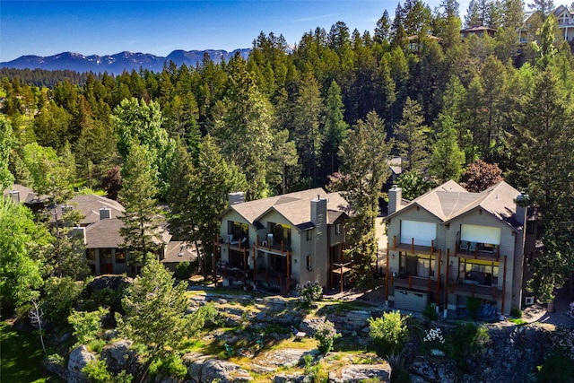 267 Eagle Bend Dr, Bigfork, MT 59911 - view from above of property with a heavily wooded area and a mountain backdrop