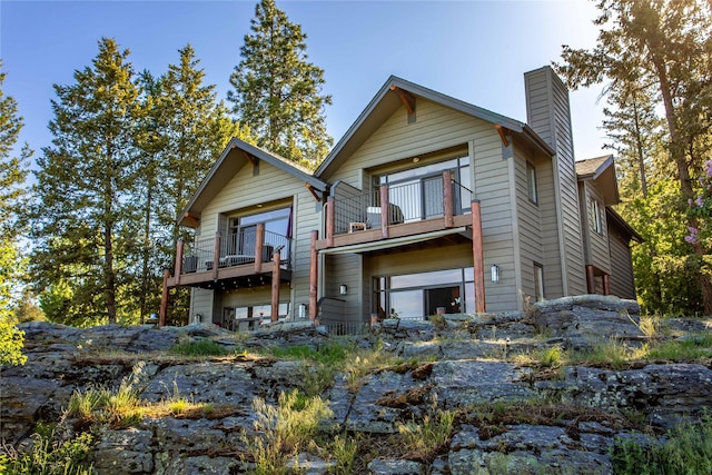 267 Eagle Bend Dr, Bigfork, MT 59911 - view of front of property with a balcony and a chimney