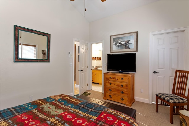 267 Eagle Bend Dr, Bigfork, MT 59911 - carpeted bedroom with baseboards, vaulted ceiling, and ensuite bathroom