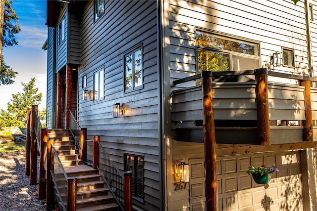 267 Eagle Bend Dr, Bigfork, MT 59911 - view of side of home featuring stairs and a garage