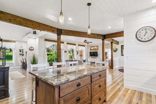 33 Shale Ct, Kalispell, MT 59901 - kitchen with a kitchen bar, plenty of natural light, light wood-style flooring, ceiling fan, and recessed lighting