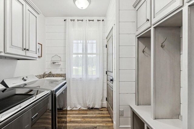 33 Shale Ct, Kalispell, MT 59901 - washroom featuring cabinet space, washing machine and clothes dryer, and wood finished floors