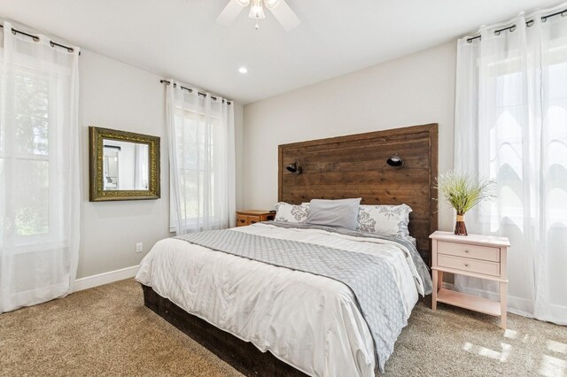 33 Shale Ct, Kalispell, MT 59901 - carpeted bedroom with multiple windows and ceiling fan