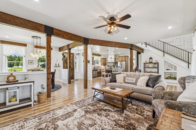 33 Shale Ct, Kalispell, MT 59901 - living area featuring light wood-style floors, a chandelier, stairway, ceiling fan, and recessed lighting