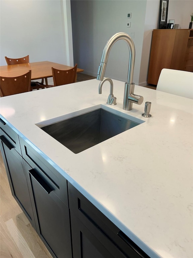 9200 River Rd, Bozeman, MT 59718 - kitchen featuring a sink and dark cabinets