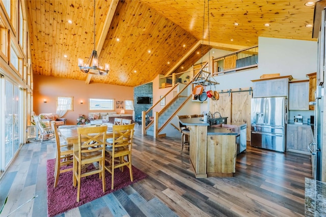 7 Papson Ridge Ln, Hall, MT 59837 - dining room with high vaulted ceiling, stairs, wooden ceiling, a chandelier, and dark wood finished floors