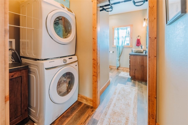 7 Papson Ridge Ln, Hall, MT 59837 - washroom featuring stacked washer / dryer and dark wood finished floors