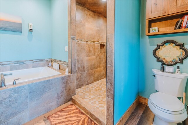 7 Papson Ridge Ln, Hall, MT 59837 - full bathroom with a bath, tiled shower, and wood finished floors