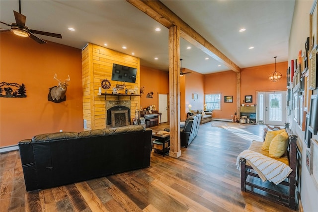 7 Papson Ridge Ln, Hall, MT 59837 - living area featuring ceiling fan, recessed lighting, a large fireplace, wood finished floors, and baseboard heating