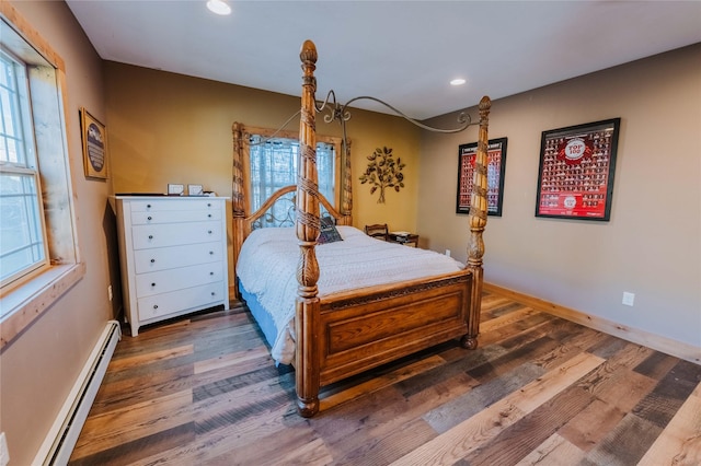 7 Papson Ridge Ln, Hall, MT 59837 - bedroom with a baseboard radiator, recessed lighting, and wood finished floors