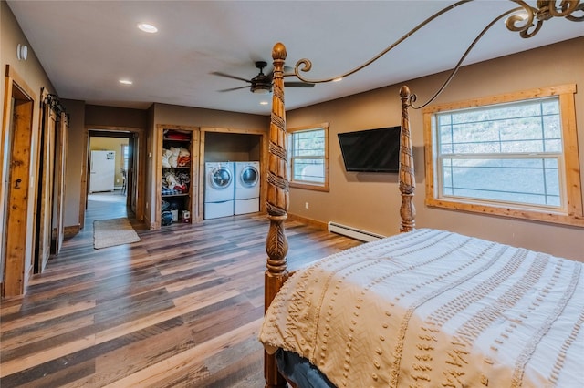 7 Papson Ridge Ln, Hall, MT 59837 - bedroom with a baseboard radiator, washing machine and dryer, freestanding refrigerator, wood finished floors, and recessed lighting