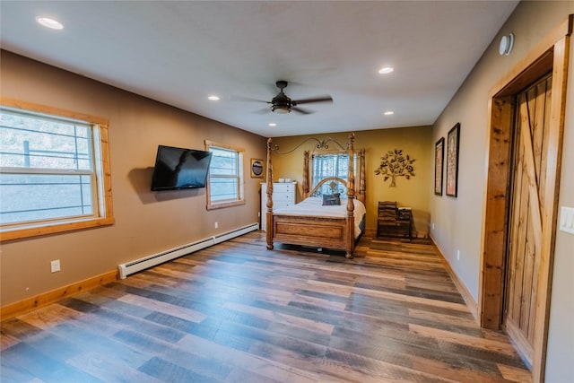 7 Papson Ridge Ln, Hall, MT 59837 - bedroom with baseboard heating, wood finished floors, recessed lighting, and a ceiling fan