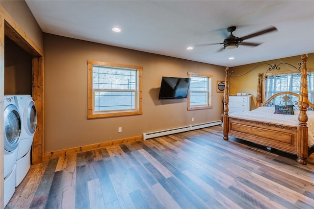 7 Papson Ridge Ln, Hall, MT 59837 - bedroom featuring separate washer and dryer, a baseboard radiator, wood finished floors, recessed lighting, and a ceiling fan