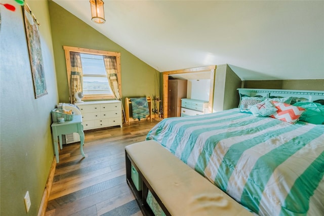 7 Papson Ridge Ln, Hall, MT 59837 - bedroom with lofted ceiling and hardwood / wood-style flooring