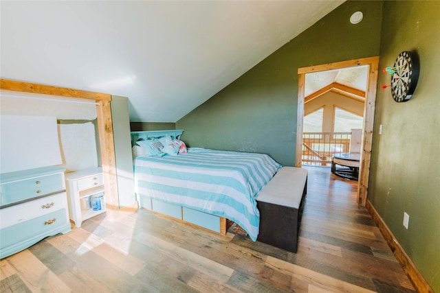 7 Papson Ridge Ln, Hall, MT 59837 - bedroom with lofted ceiling and wood finished floors