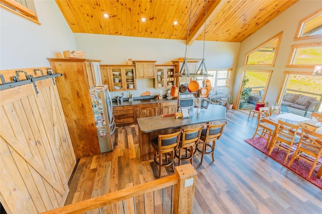 7 Papson Ridge Ln, Hall, MT 59837 - dining space featuring wooden ceiling, recessed lighting, and wood finished floors