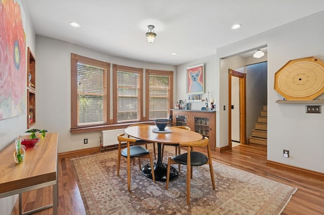 314 9th Ave W, Kalispell, MT 59901 - dining area with radiator heating unit, wood finished floors, plenty of natural light, and recessed lighting
