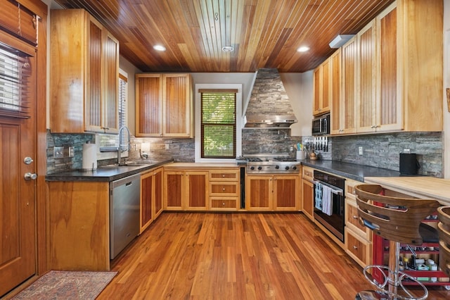 314 9th Ave W, Kalispell, MT 59901 - kitchen with appliances with stainless steel finishes, a sink, wall chimney range hood, wooden ceiling, and light wood-type flooring