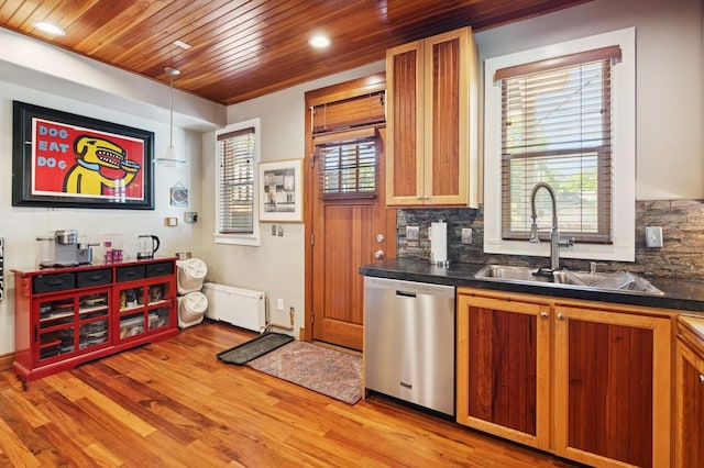 314 9th Ave W, Kalispell, MT 59901 - kitchen with stainless steel dishwasher, a sink, dark countertops, wood ceiling, and light wood-style floors