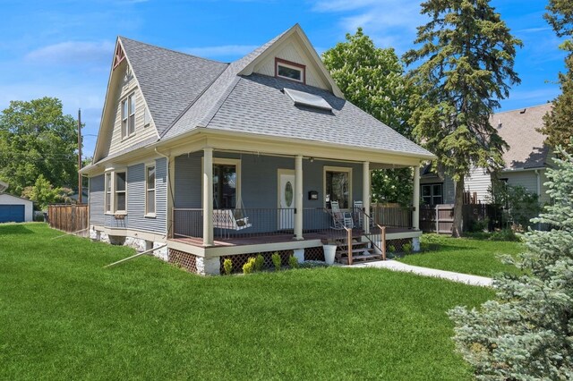 314 9th Ave W, Kalispell, MT 59901 - view of front of house with a shingled roof, a front lawn, and a porch
