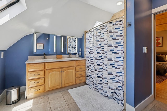314 9th Ave W, Kalispell, MT 59901 - ensuite bathroom featuring vaulted ceiling, tile patterned flooring, curtained shower, and double vanity